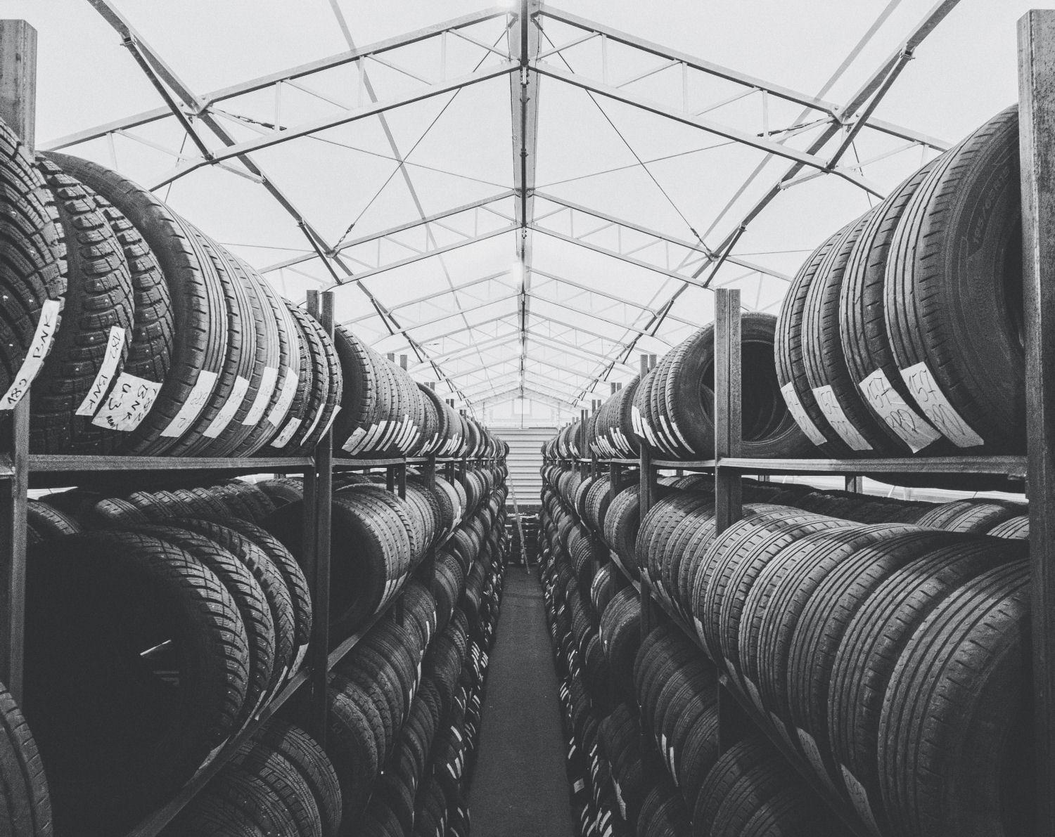 Warehouse full of car tires laid out on the shelves